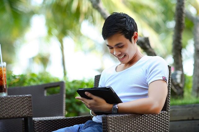 Man reading on tablet